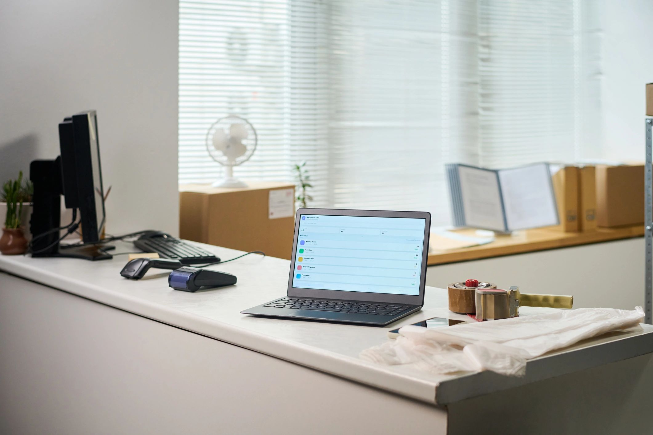 Desk with laptop representing secure information management
